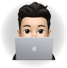 Person peeking from behind laptop